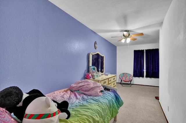 bedroom featuring light colored carpet and ceiling fan