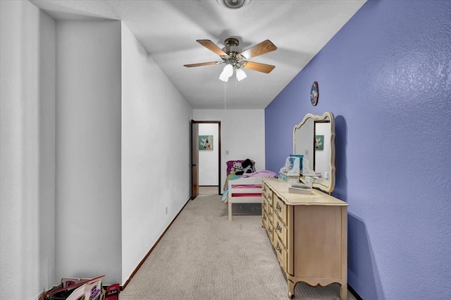 carpeted office featuring ceiling fan