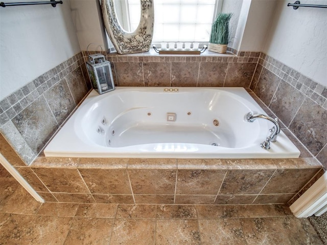 bathroom featuring tiled tub