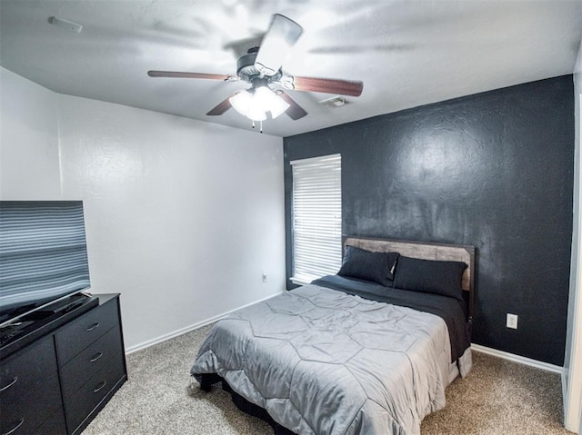 bedroom featuring ceiling fan and light carpet