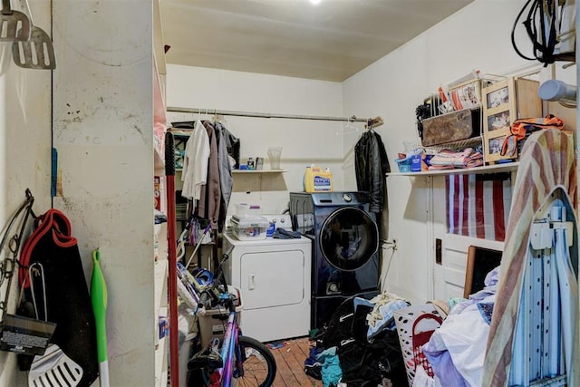 laundry room featuring washer and clothes dryer and wood-type flooring