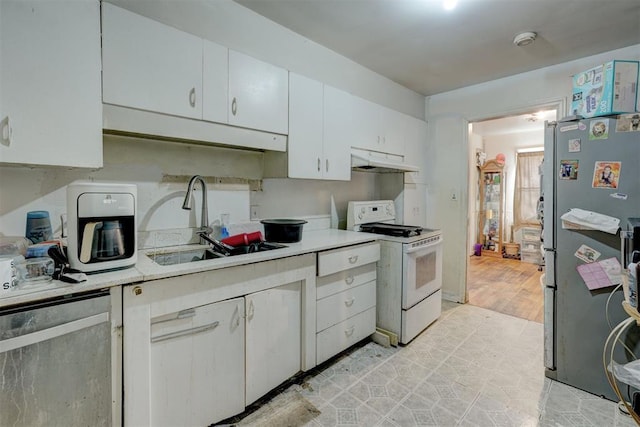 kitchen featuring white cabinetry, appliances with stainless steel finishes, and sink