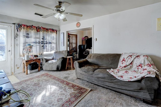 living room featuring ceiling fan and carpet flooring