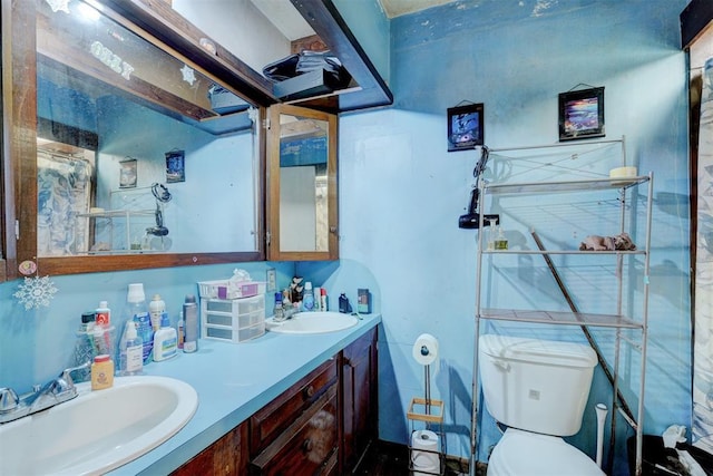 bathroom with vanity and toilet