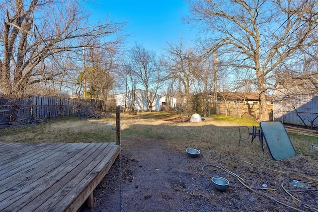 view of yard with a wooden deck