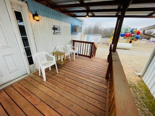 wooden deck featuring cooling unit