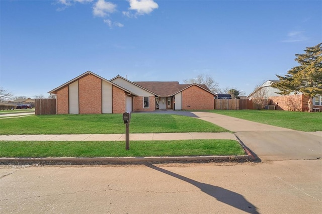 single story home featuring a front yard