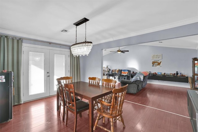 dining room featuring french doors, ceiling fan, ornamental molding, and dark hardwood / wood-style flooring