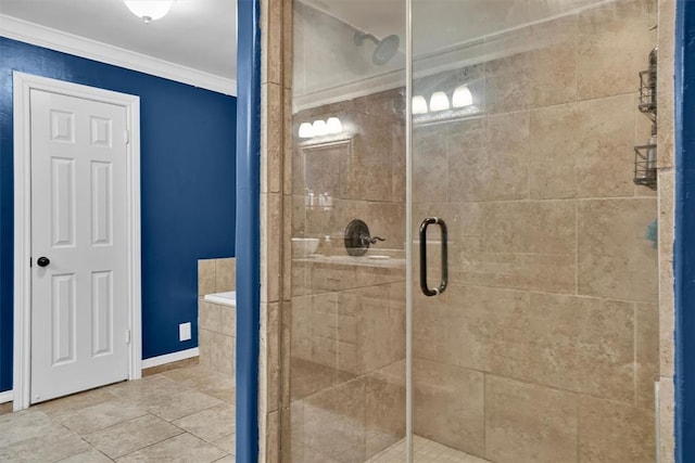 bathroom featuring crown molding and a shower with door