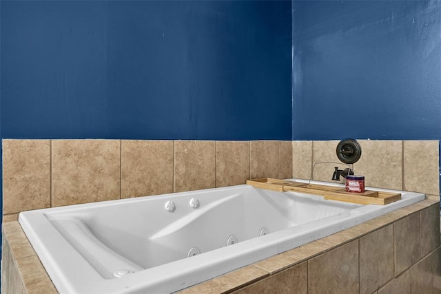 bathroom featuring tiled tub