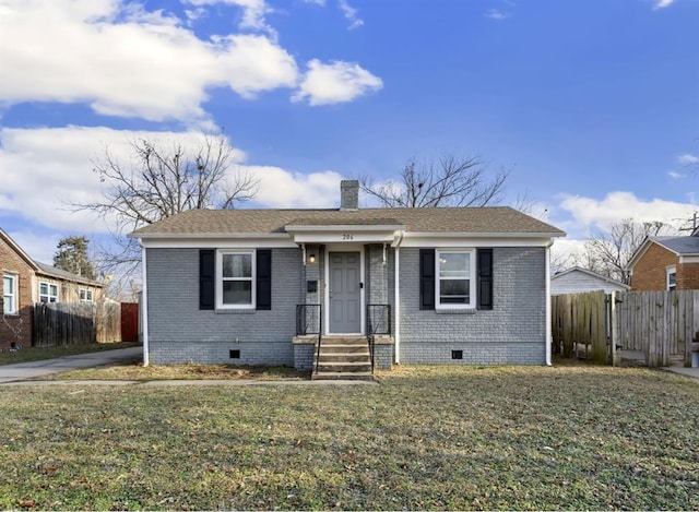 bungalow-style house featuring brick siding, crawl space, a chimney, and fence