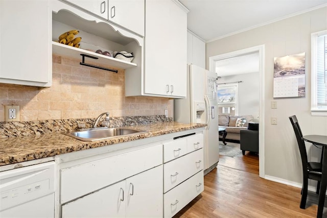 kitchen featuring light stone countertops, white appliances, and white cabinets