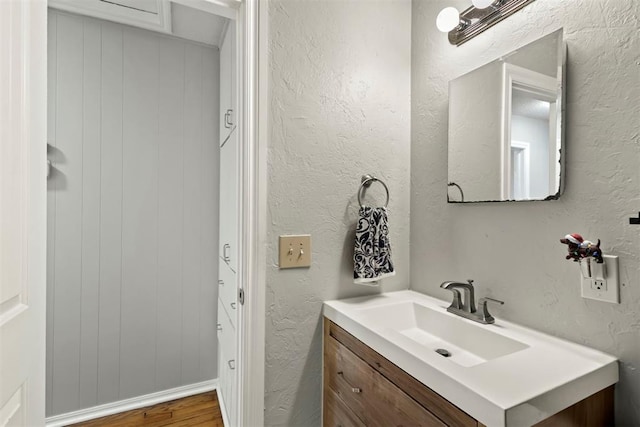 bathroom featuring vanity and wood-type flooring