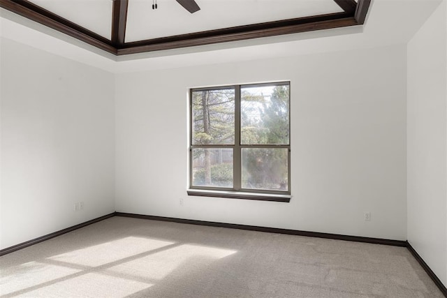 spare room featuring light colored carpet and ceiling fan
