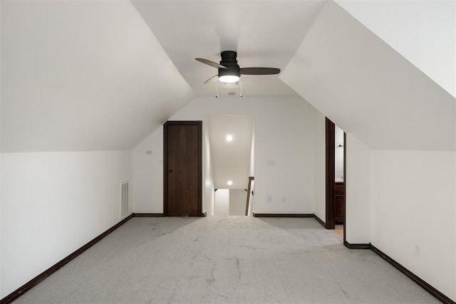 bonus room with light colored carpet, ceiling fan, and vaulted ceiling