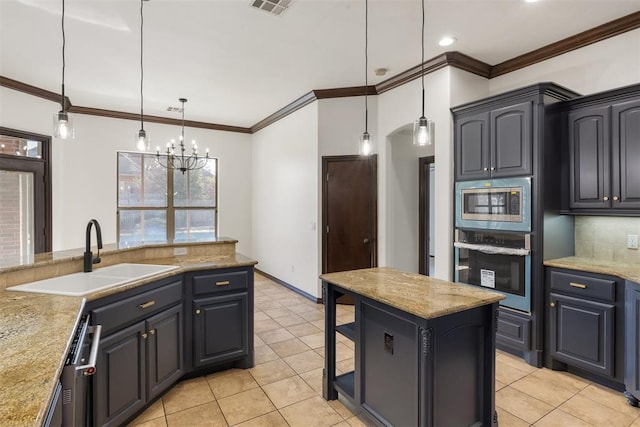 kitchen with hanging light fixtures, backsplash, stainless steel appliances, and sink