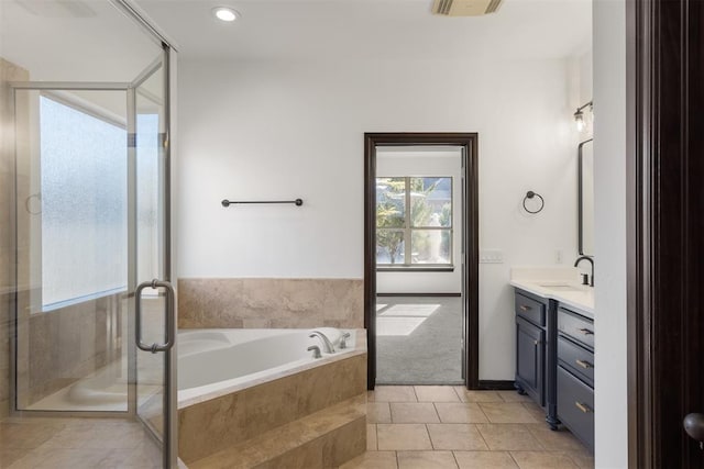 bathroom featuring tile patterned floors, vanity, and independent shower and bath
