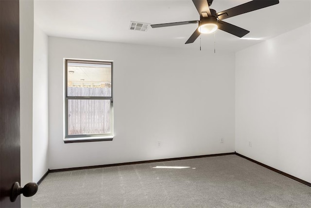 unfurnished room featuring ceiling fan and light colored carpet