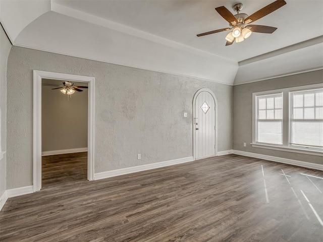 spare room with ceiling fan, lofted ceiling, and dark hardwood / wood-style floors