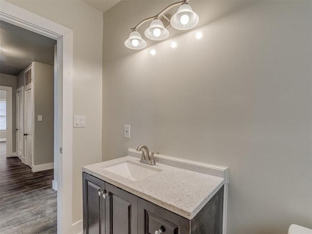 bathroom featuring vanity and hardwood / wood-style floors