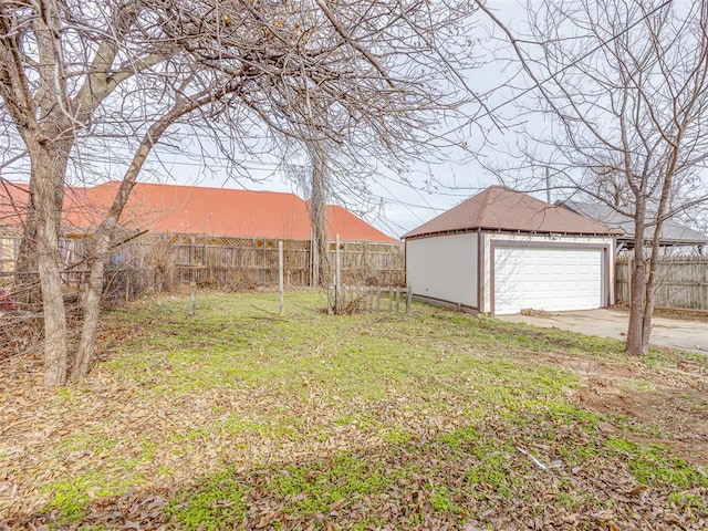 view of yard with a garage and an outdoor structure