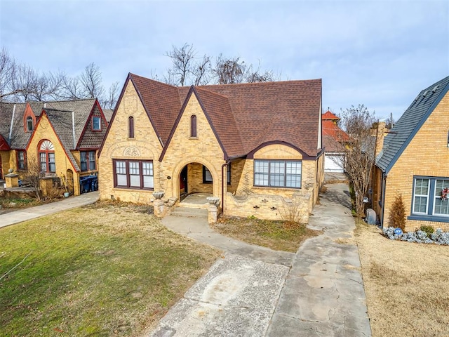 tudor house with a front yard