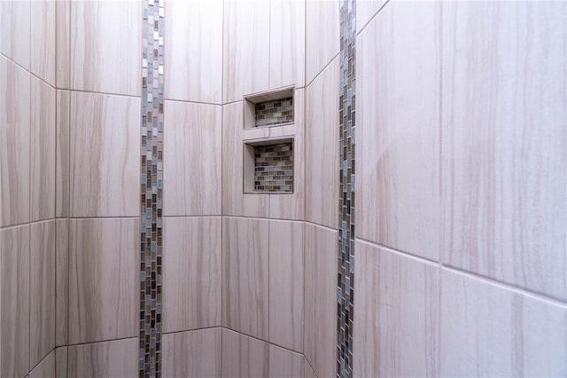 room details with a tile shower