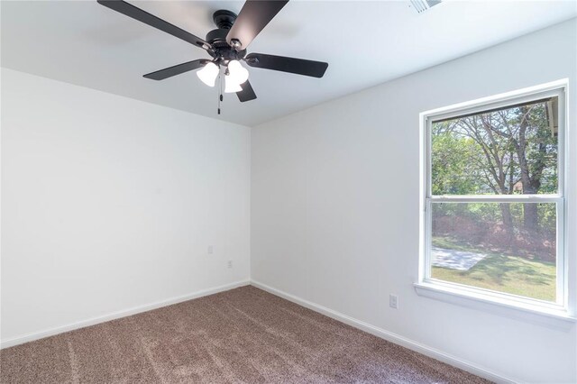 spare room with ceiling fan and carpet flooring