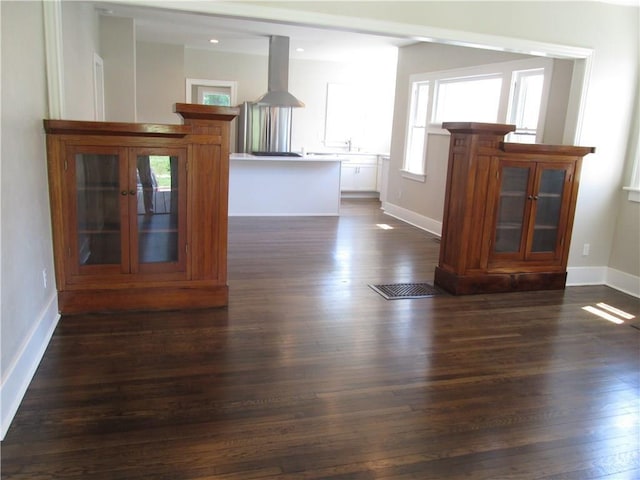 spare room with dark wood-type flooring