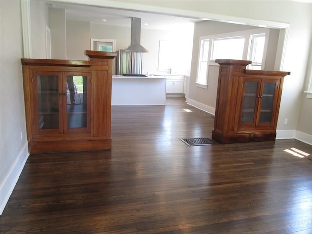 212 NE 15th St, Oklahoma City, OK 73104 - living room featuring dark wood-type flooring and baseboards