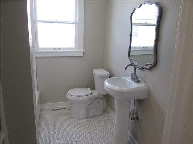 212 NE 15th St, Oklahoma City, OK 73104 - bathroom with a bath, tile patterned floors, and a shower