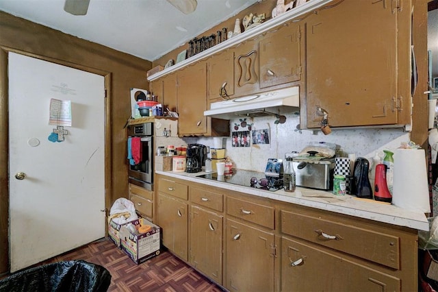 kitchen featuring dark parquet floors, stainless steel oven, backsplash, and black electric cooktop