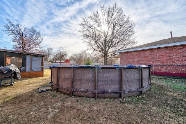 view of yard with a fenced in pool