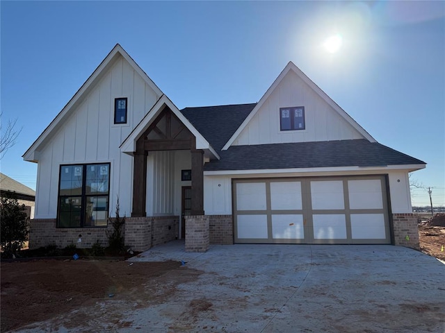 modern farmhouse style home featuring a garage