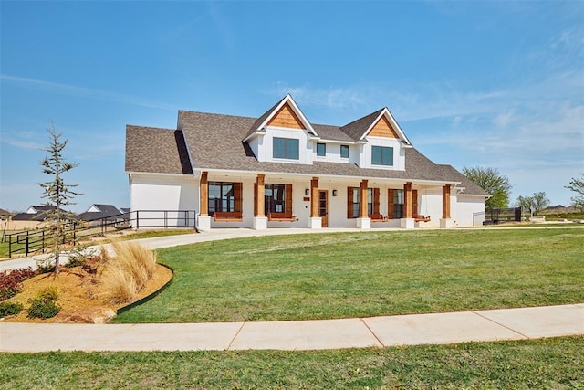 craftsman-style house with a porch, a garage, and a front yard