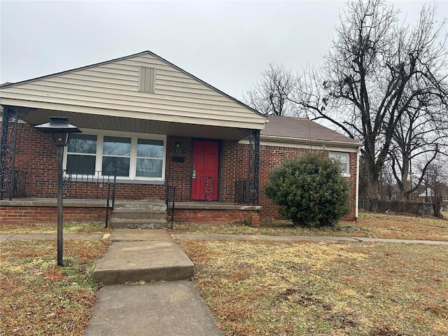 bungalow with a front yard