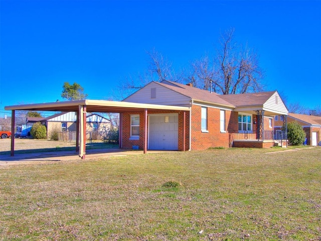 view of front of house with driveway, a garage, a front lawn, a carport, and brick siding