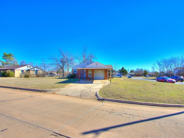 view of front of house with an attached garage, driveway, brick siding, and a front yard