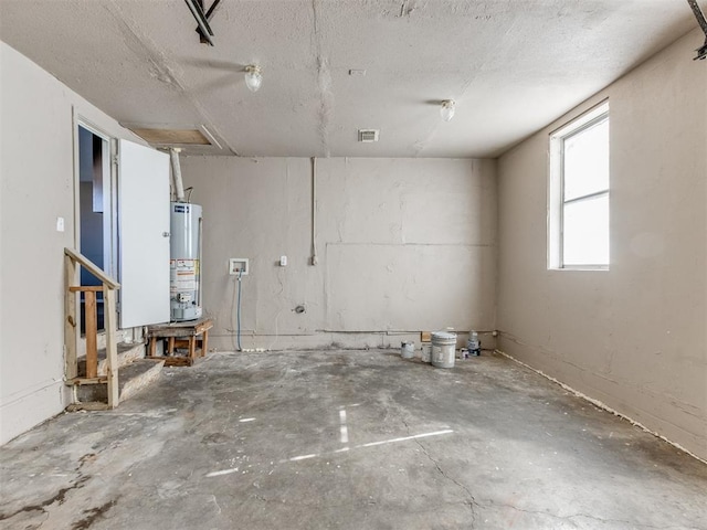 garage with visible vents and gas water heater