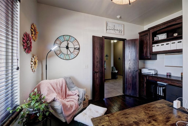 kitchen featuring dark brown cabinetry and wood-type flooring