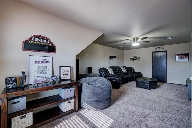 living room with ceiling fan and carpet flooring