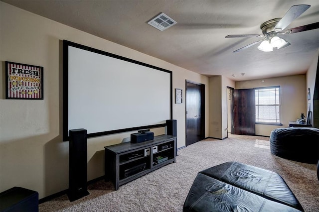 home theater with light colored carpet and ceiling fan