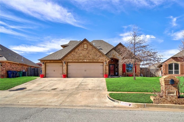 view of front facade featuring a garage and a front lawn