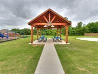 view of property's community with a yard and a gazebo