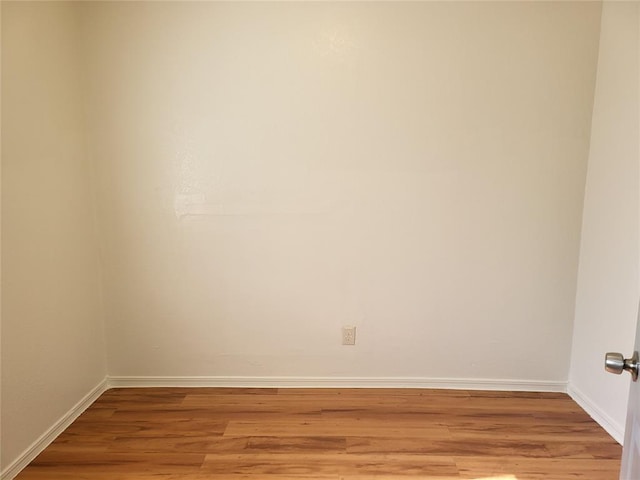 empty room with light hardwood / wood-style flooring