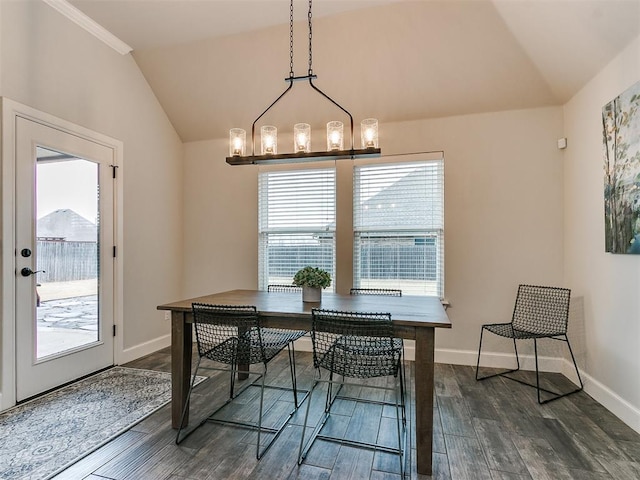 dining room featuring lofted ceiling, a notable chandelier, and dark hardwood / wood-style floors