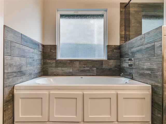 bathroom featuring a washtub