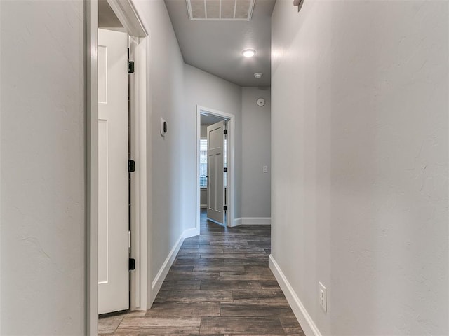 hall featuring dark wood-type flooring