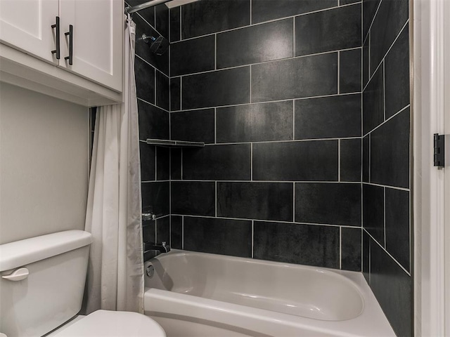 bathroom featuring shower / bath combo and toilet