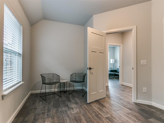 sitting room with lofted ceiling and dark hardwood / wood-style floors